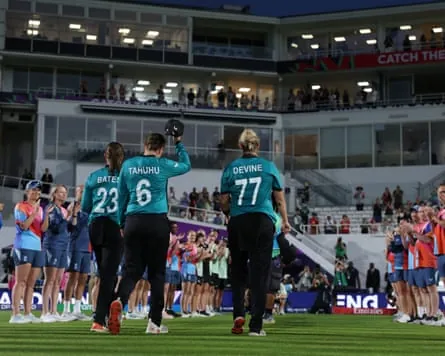 Suzie Bates, Lea Tahuhu and Sophie Devine of New Zealand receive a guard of honour as they retire from T20 internationals.