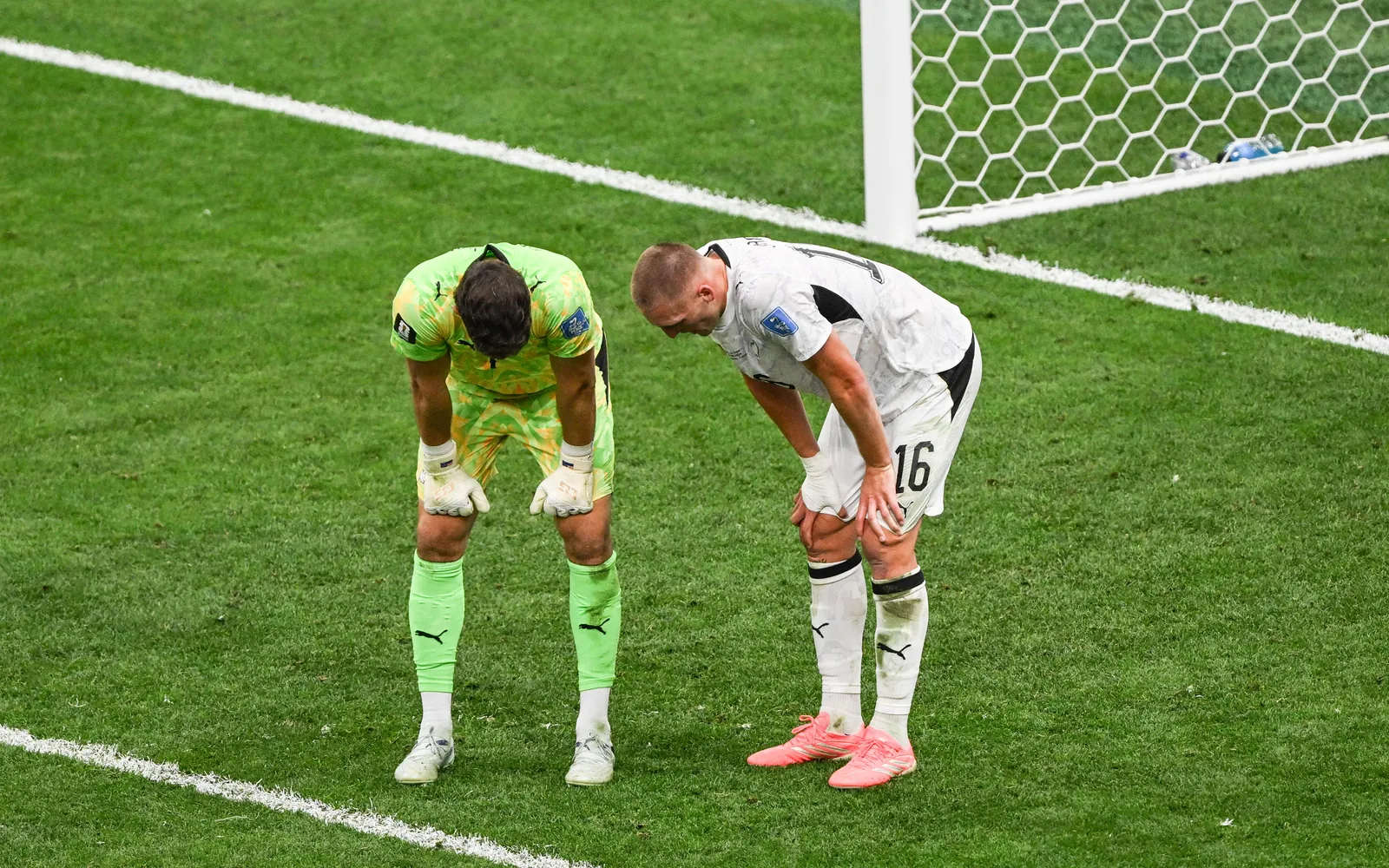 Goalkeeper Max Crocombe of New Zealand and Finn Surman of New Zealand dejected after the match.