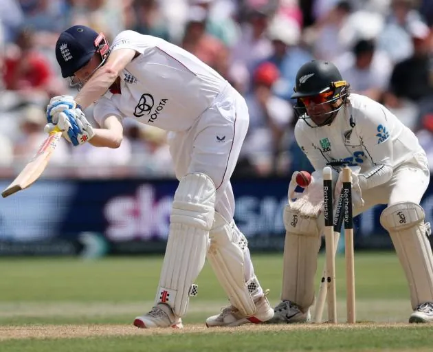 England's Harry Brook has his stumps knocked over by Zak Foulkes as Tom Blundell looks on. Photo:...