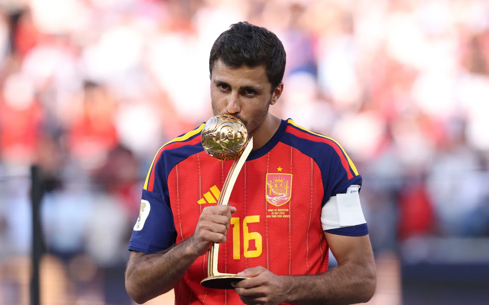 EAST RUTHERFORD, NEW JERSEY - JULY 19: Rodri #16 of Spain is presented with the Golden Ball award after the FIFA World Cup 2026 Final match between Spain and Argentina at New York New Jersey Stadium on July 19, 2026 in East Rutherford, New Jersey. (Photo by Carl Recine/Getty Images)