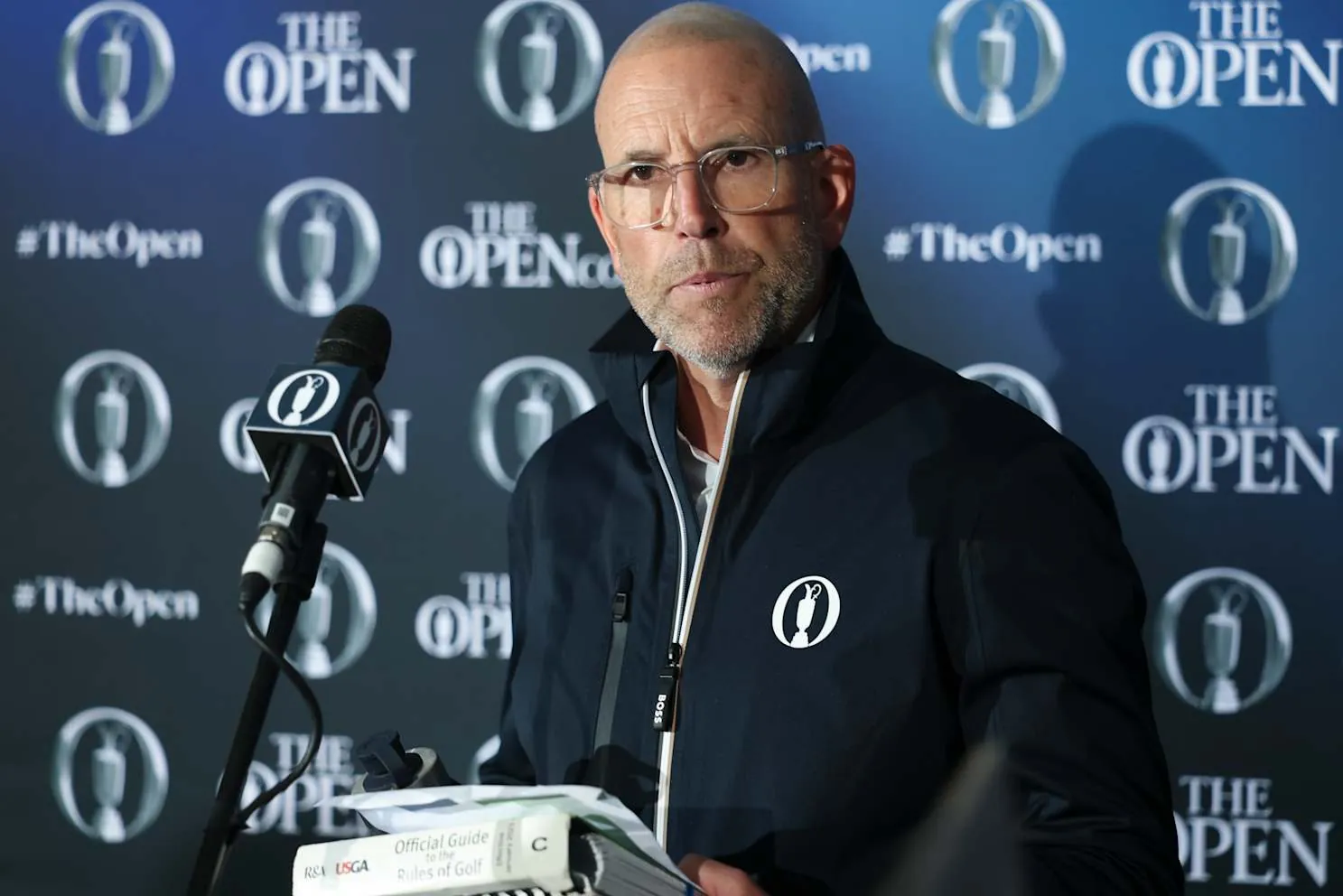Grant Moir, executive director of governance at The R&A, speaks after a two-stoke penalty was given to DeChambeau.